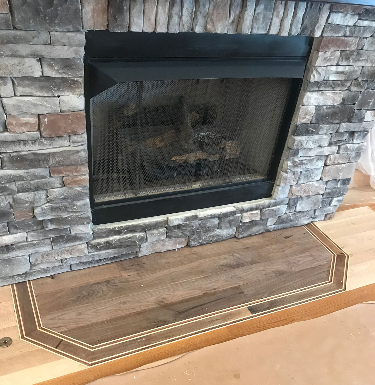 Custom hardwood hearth inlay
